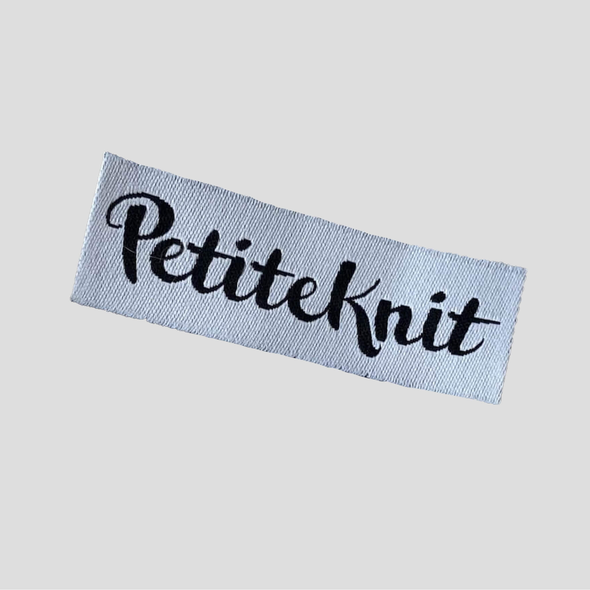 PetiteKnit - Etikett